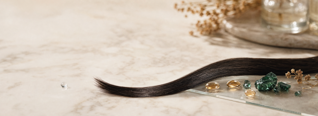 Glossy smooth hair strands beside Make Beauty hair care product bottles